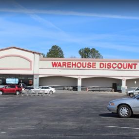 Warehouse Discount Groceries Town Square front entrance and signage.