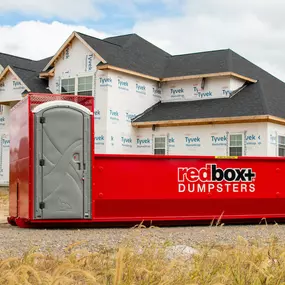 an elite dumpster being delivered to a jobsite in Denver