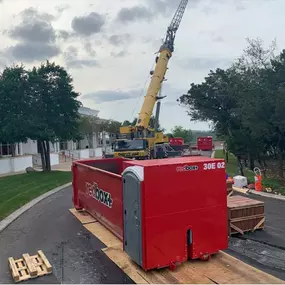 construction dumpster with portable toilet in Orlando