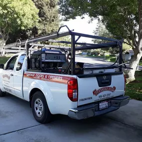 Overhead Door Company of Sacramento, Inc. fleet truck on the road, providing reliable garage door maintenance, replacement, and emergency repair across the greater Sacramento area.