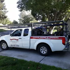 Branded service truck for Overhead Door Company of Sacramento, Inc., delivering expert garage door installation and repair services throughout Sacramento and nearby communities.