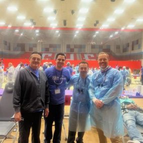 These photos highlight a recent event with company activities. We have a heartwarming group shot taken in the school gym, capturing Dr. Jake Williams alongside his colleagues volunteering at the Texas Mission of Mercy event, where they provided free dental services to those in need.