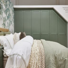 Sloped Ceiling Fitted Wardrobes and coordinating bedside table in Willow Green