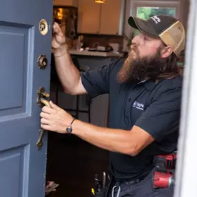 Locksmith rekeys a front door