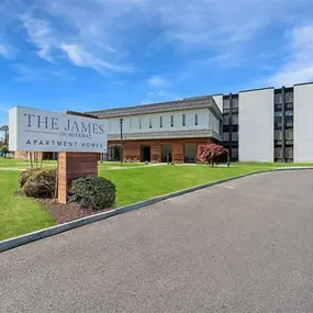 an image of the apartments sign in front of the building