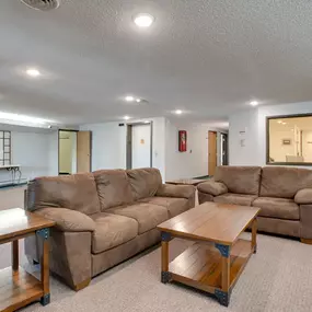 Community room with couches and tables, Ridgewood Apartments, Grand Forks, ND