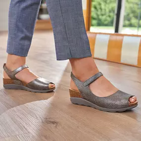 Open up your spring wardrobe with the Marcy wedge sandal. It features an open toe and a fully adjustable ankle strap with hook and loop closure.