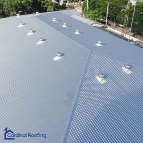 Overhead view of a commercial business with metal roof