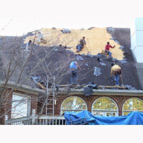 Workers Cleaning up the Roof