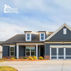 Home with gray roof and blue siding.