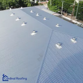 Overhead view of a commercial business with metal roof