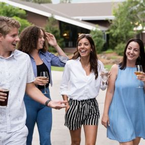 Friends walking in front of Grand America Flagstaff after getting drinks.