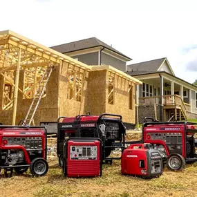 Different types of Honda generators displayed on a construction site