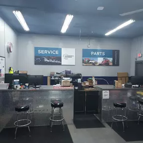 Inside view of the parts and service counter area, with branded signage for Chadwick-BaRoss