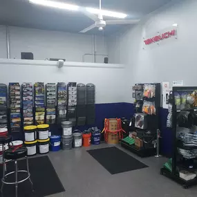 Retail corner of the parts department featuring buckets, brochures, tools, and branded merchandise displays
