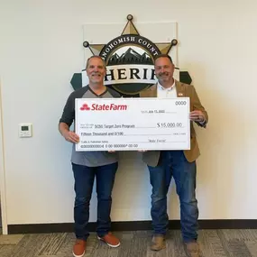 Monte Cain State Farm Insurance Agent is honored to have been selected to present a SF donation to Snohomish County sheriff's office.