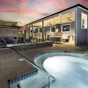 a spa with a pool and a house in the background