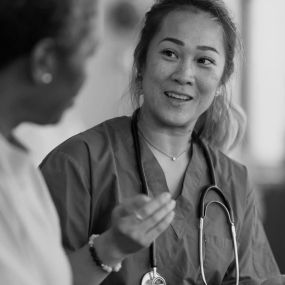 Nurse speaking with her patient