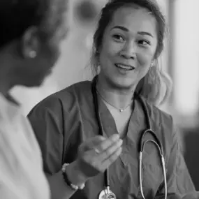 Nurse speaking with her patient