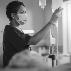 Nurse setting a patient's IV