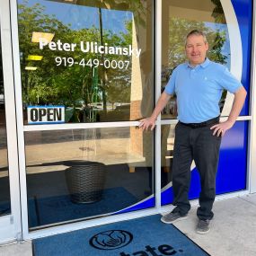 Peter Uliciansky standing in front of the Agency in Raleigh, North Carolina