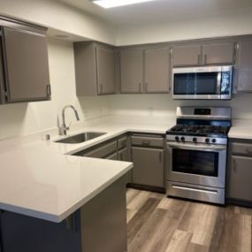 kitchen with upscale appliances and designer touches at Villa Mondavi apartments in Bakersfield