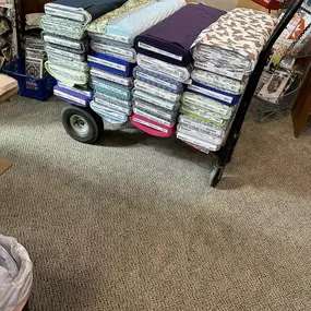 Our Jaftex challenge video plans have been temporarily thwarted due to the store's unpacking and shelving process. Please bear with us as we prepare. The upside is that we now have a vast array of beautiful new fabrics to work with!