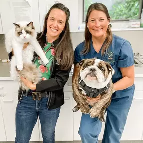 One of our Partners, Dr. Schilke, and Dr. Gallagher from Pound Ridge Veterinary Center are all smiles as they pose for a photo with two adorable patients!