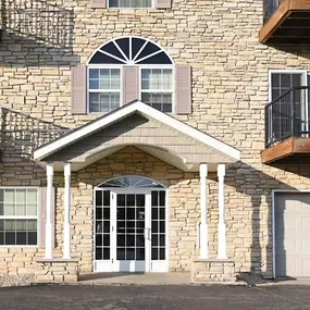 the front of a brick house with a white garage door Pinewood Estates, Zimmerman, 55398