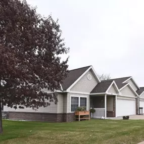 a house with a tree in front of it