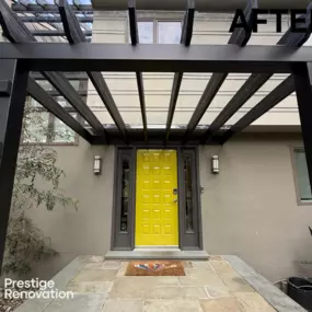 This striking entryway transformation features a sophisticated Fortress steel pergola system installed by Prestige Renovation.