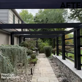 This striking entryway transformation features a sophisticated Fortress steel pergola system installed by Prestige Renovation.