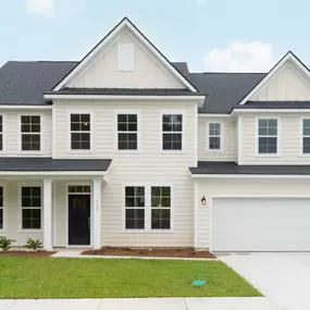 Two story home with white siding and two car garage in DRB Homes Enclave South Point Estates community