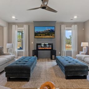 Family room and fireplace in DRB Homes Riverbend Overlook