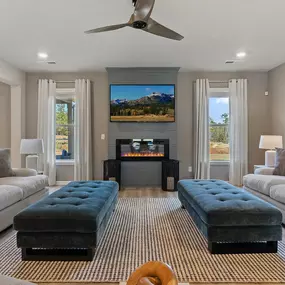 Family room and fireplace in DRB Homes Riverbend Overlook