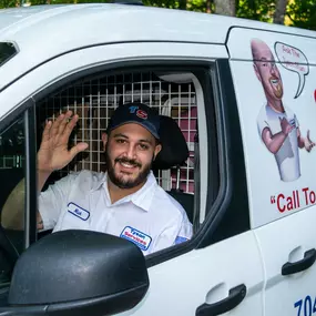 Tyson Services Technician Waiving in Van