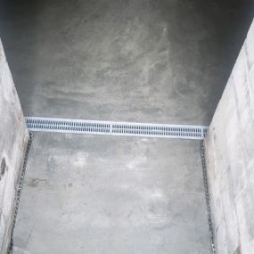 poured concrete and drain system installation