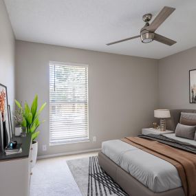 Renovated bedroom with plush grey carpeting