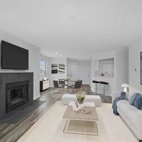 Living room with a couch and a fireplace