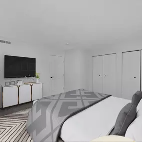 Bedroom with a large bed and a tv