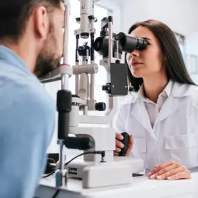 Female Optometrist giving an eye exam