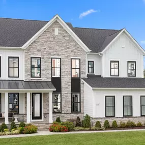 White two story estate home in the Emory II model in the DRB Homes Hartland community