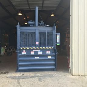 Vertical balers are a compact way to reduce waste and associated disposal costs.