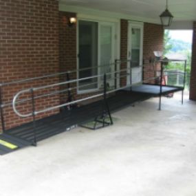 This wheelchair ramp provides safe and dry access under the carport for the resident of this Johnson City, TN home