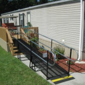 Amramp provides access with a wheelchair ramp from the back deck of this home in Knoxville, TN