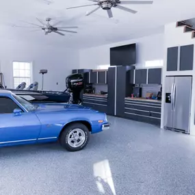 Garaage or Man Cave? Epoxy floor, garage workbench and cabinets.