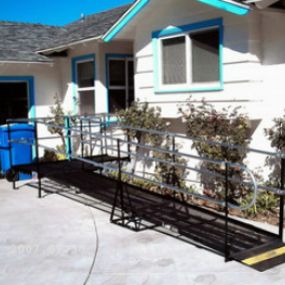 A residential steel wheelchair ramp installed in Bastrop, Texas, for an elderly couple.
