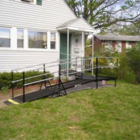 Residential installation of a 22-foot-long Amramp wheelchair ramp makes this Springfield, MA home accessible.