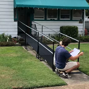 This ramp was installed for the wife of a US Navy veteran who saw another installation on their street. Joe is seen reviewing safety items with the customer.