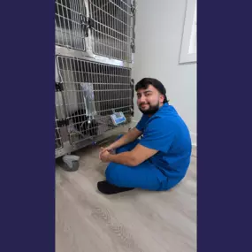 Overpeck Creek Animal Hospital team member giving snuggles to a patient.